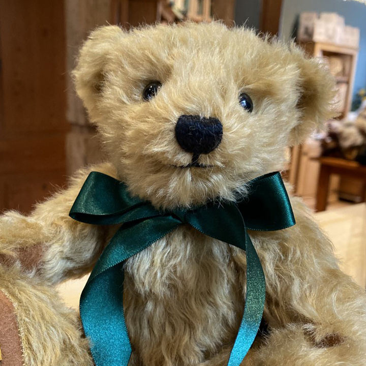 With a sweet smile and truly timeless design, Shrewsbury is a teddy bear for all the family to enjoy. Handmade from the softest golden mohair, with chestnut-brown pure wool felt paws and a satin ribbon in British racing green, he rivals 'London Gold' as Merrythought’s most popular traditional bear