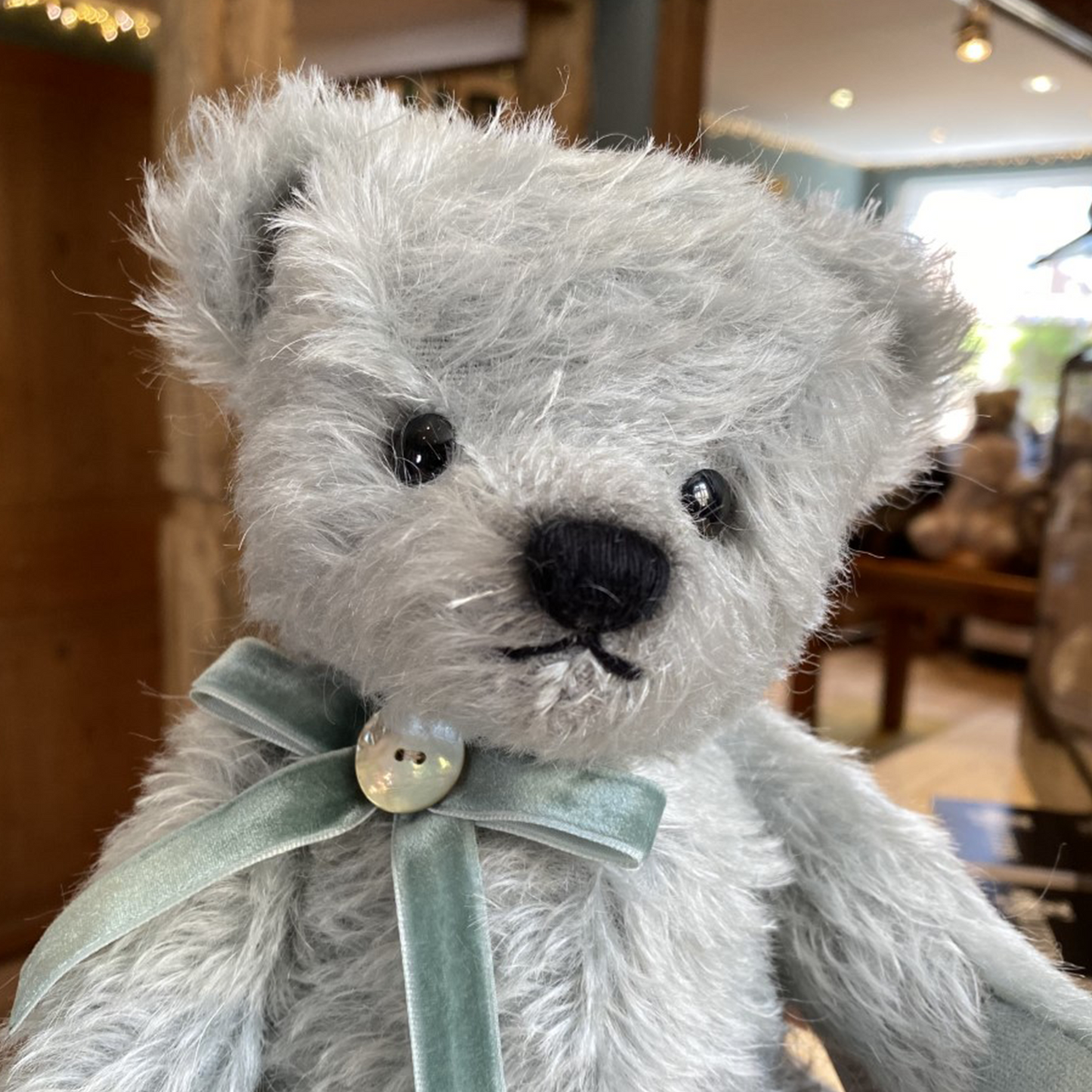 This absolutely stunning Teddy Bear from Teddy Hermann is crafted from the finest pale teal mohair and has a matching velvet ribbon bow around its neck which is finished with a mother of pearl button.  Limited to 200 pieces worldwide