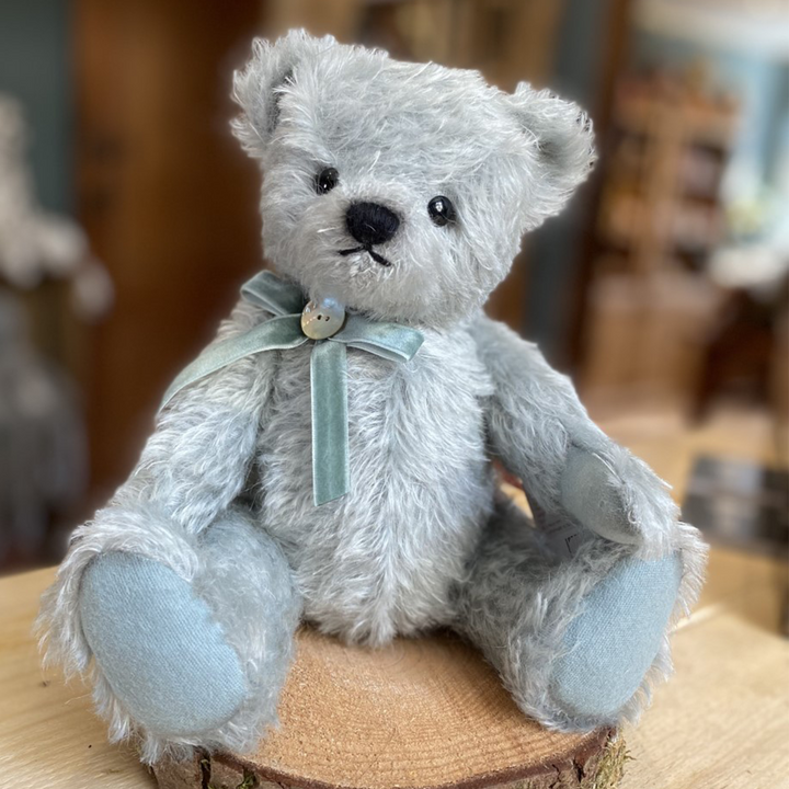 This absolutely stunning Teddy Bear from Teddy Hermann is crafted from the finest pale teal mohair and has a matching velvet ribbon bow around its neck which is finished with a mother of pearl button.  Limited to 200 pieces worldwide