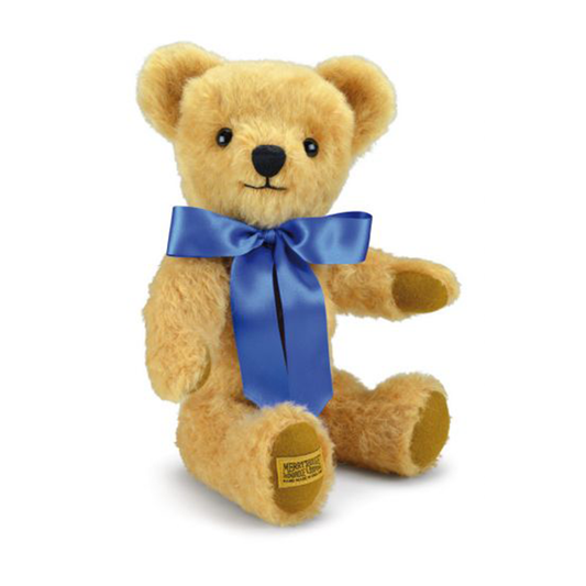 This charming traditional teddy bear has similar broad appeal to his cousin, London Gold. Based on the same distinctive patterns, and featuring light gold distressed mohair and a warm smile, London Curly Gold is the ideal companion for all ages. Oak-brown wool felt paws and a royal blue satin ribbon complete his exquisite design.
