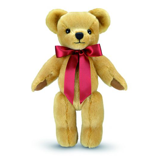 London Gold is an iconic Merrythought character, and the ultimate first teddy bear to be treasured for years to come. Expertly hand-crafted from velvety soft golden mohair, with milk chocolate wool felt paws, this bear is a true classic. A simple scarlet satin bow is the perfect accompaniment.  This beautiful bear has a 'Brahms Lullaby' music box.