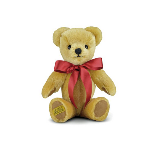 London Gold is an iconic Merrythought character, and the ultimate first teddy bear to be treasured for years to come. Expertly hand-crafted from velvety soft golden mohair, with milk chocolate wool felt paws, this bear is a true classic. A simple scarlet satin bow is the perfect accompaniment.  Each Merrythought soft toy in the Traditional Collection is presented with a drawstring bag, to help keep your new companion clean and dust-free.
