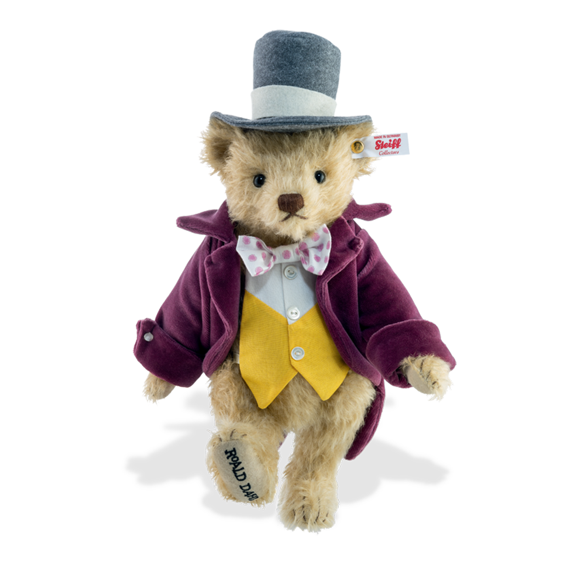 Steiff Willy Wonka Teddy Bear made from the finest beige mohair, fully jointed.  Dressed in a dark pink jacket, yellow and white waistcoat and matching dark pink and white bow tie. Limited edition of just 1,916 pieces.